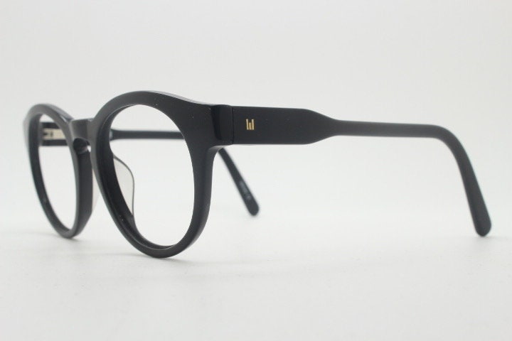 Will i Am round thick frame glasses model 30715554. Black gloss acetate optical frames with keyhole bridge. Prescription eyeglasses. RX