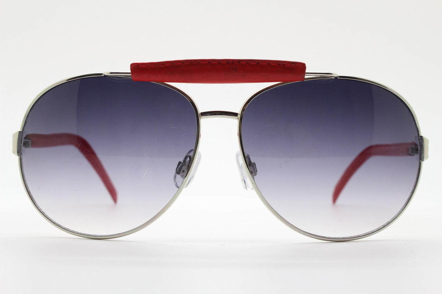 Y2K vintage aviator sunglasses. 2000's silver metal frame with exaggerated bridge in red trim. 70s racing design. 00's NOS aviators