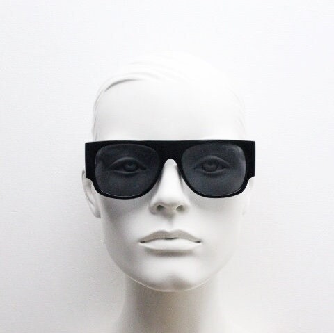 Y2K vintage rectangular side panel sunglasses. Black gloss frame with grey lenses and side window spoilers / blinkers. 2000s NOS goggle