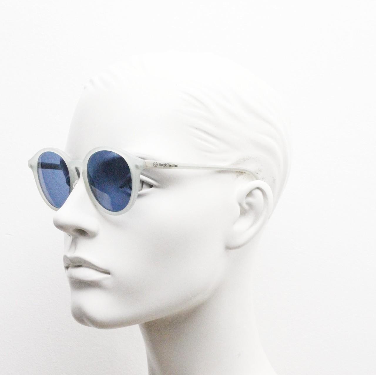 Sergio Tacchini 80s vintage round horn rim sunglasses made in Italy. Transparent pale blue frosted acetate frame with navy lenses. NOS