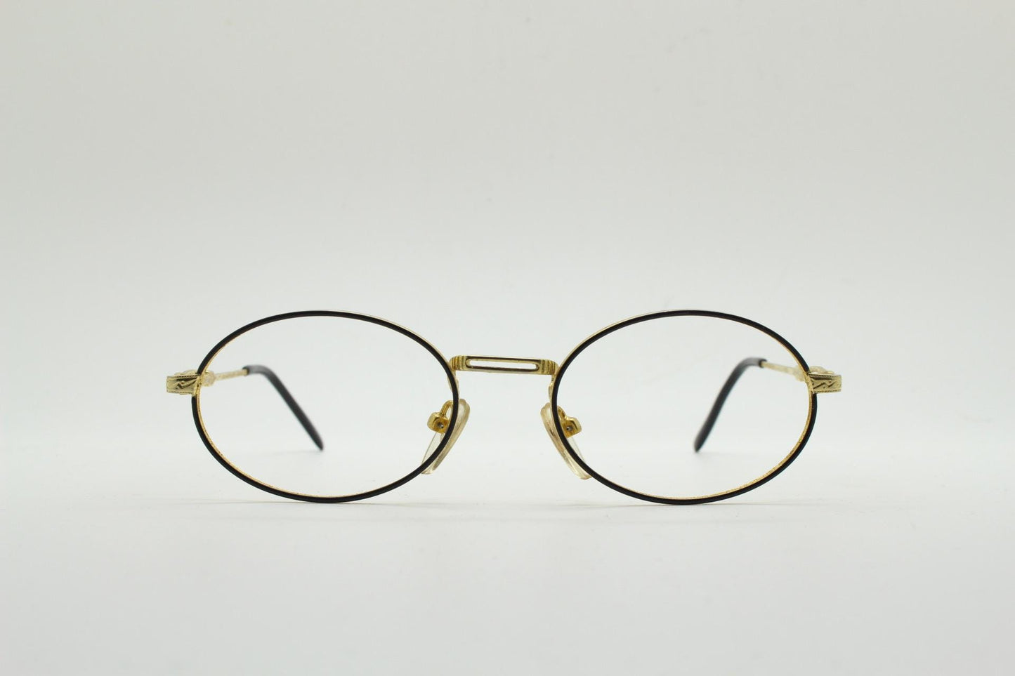 90s vintage small oval eye glasses. Gold and black optical frames with ornate arm details. Prescription RX steampunk spectacles. NOS
