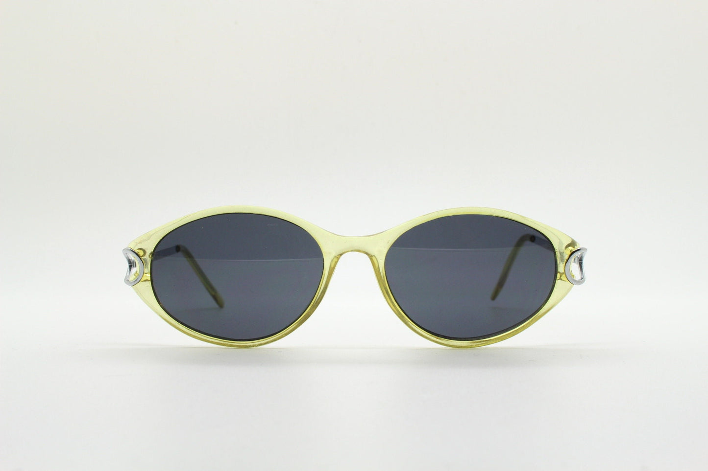 Carven Paris 90s vintage oval sunglasses. Womens transparent yellow frame with black lenses and silver metal arms. NOS