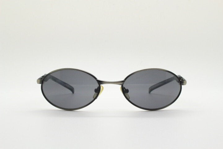 90s vintage small oval  bug eye sunglasses. Brushed bronze finish frame with transparent grey arms. Y2K. 2000s. Unworn NOS