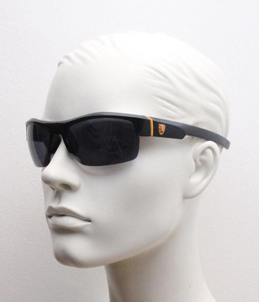Y2K vintage sport shield sunglasses. All matt black wraparound aerodynamic visor with orange detail. 2000's. 90s. Unused NOS