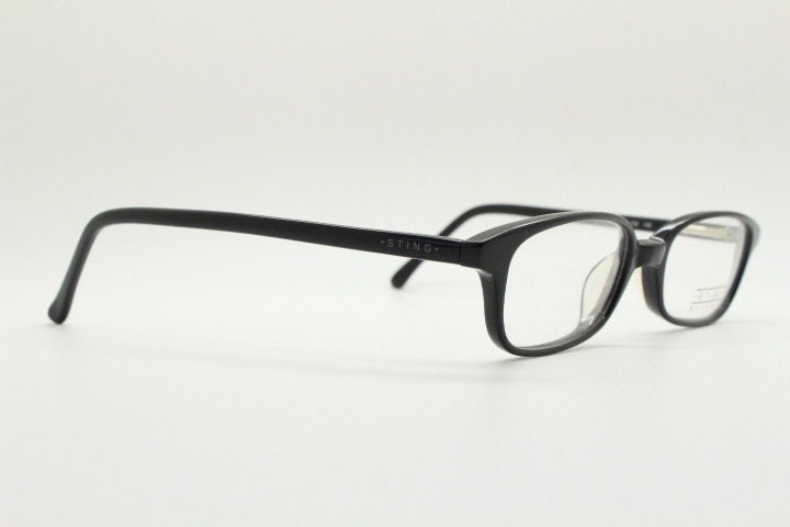 Sting 90s vintage rectangular eye glasses made in Italy. Plain black gloss low profile acetate optical frames. Prescription RX. NOS