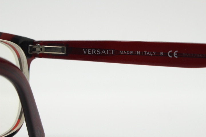 Versace modified wayfarer design eye glasses made in Italy. Mottled brown acetate optical frames with subtle logo. Prescription eyeglasses
