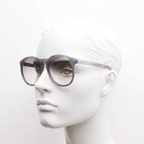Michele L'Amy 80s vintage round sunglasses made in France. Lustrous marbled blue frame with keyhole bridge and graduating brown lenses