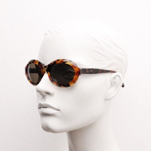 Francois Pinton Paris 90s vintage oval sunglasses made in France. Womens thick acetate frame in brown and amber tones. NOS