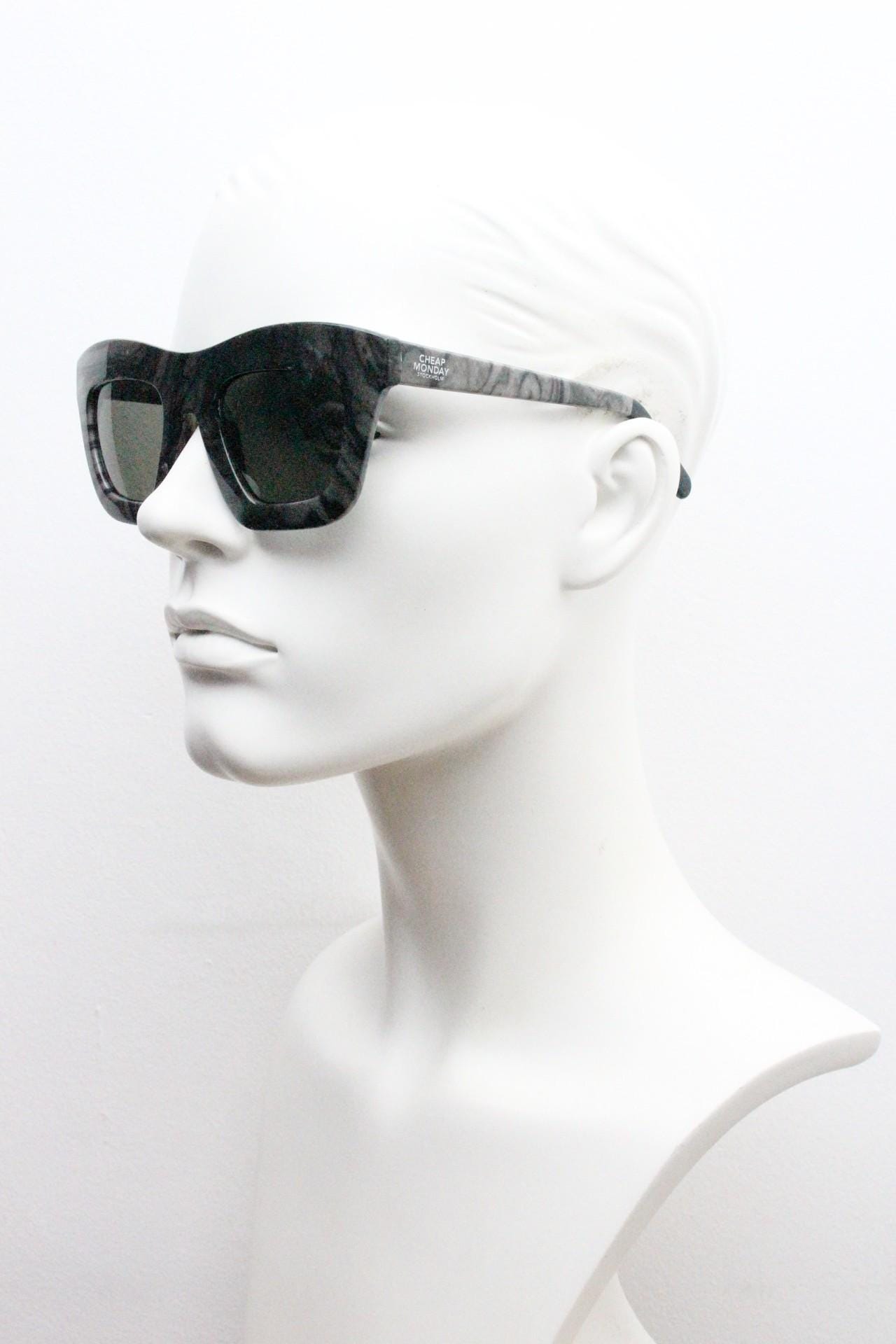 Cheap Monday thick frame cateye sunglasses. Womens chunky oversized grey and black marble cat eye with dark green lenses. Y2k vintage