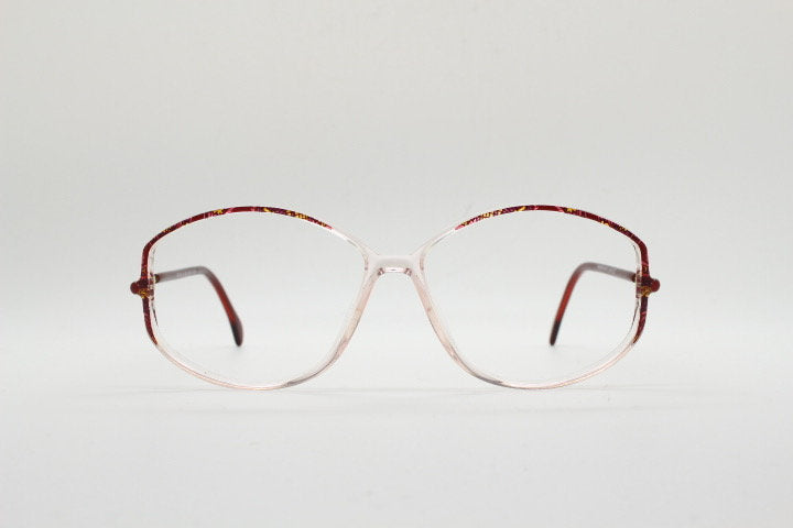 Silhouette 80s vintage hexagon eye glasses made in Austria. Transparent crystal optical frame with abstract red pattern. Prescription RX