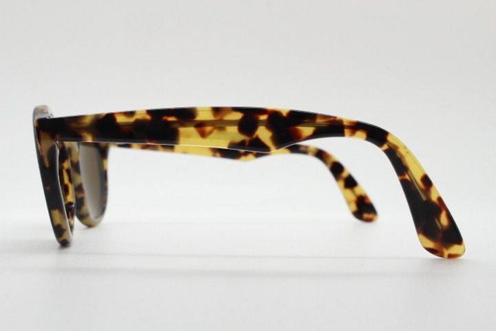 Francois Pinton Paris 90s vintage round sunglasses made in France. Womens thick acetate frame in honey tortoise brown tones. NOS