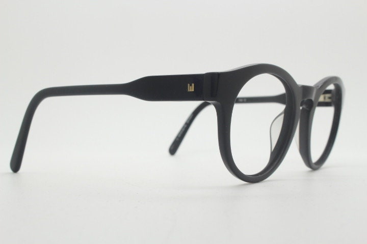 Will i Am round thick frame glasses model 30715554. Black gloss acetate optical frames with keyhole bridge. Prescription eyeglasses. RX