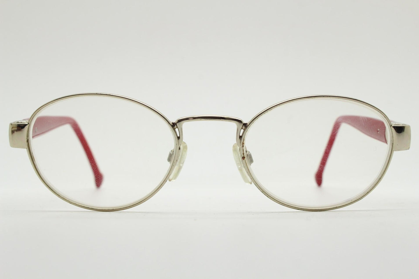 Red or Dead Y2K vintage oval eye glasses. Green or red interchangeable arms on a chrome metal frame. Optical prescription eyeglasses. RX