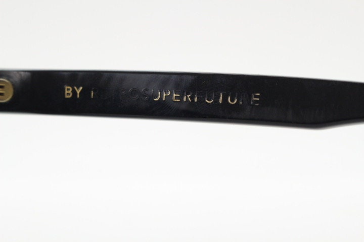 Retrosuperfuture thick flat top cat eye sunglasses hand made in Italy. All black gloss acetate frame. Vintage