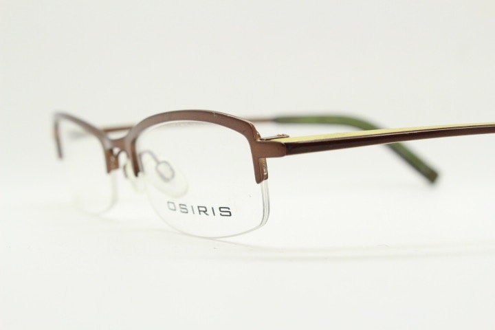 Osiris 90s vintage rectangular half rim eye glasses. Low profile optical frame in handsome brown chrome. Prescription RX Spectacles
