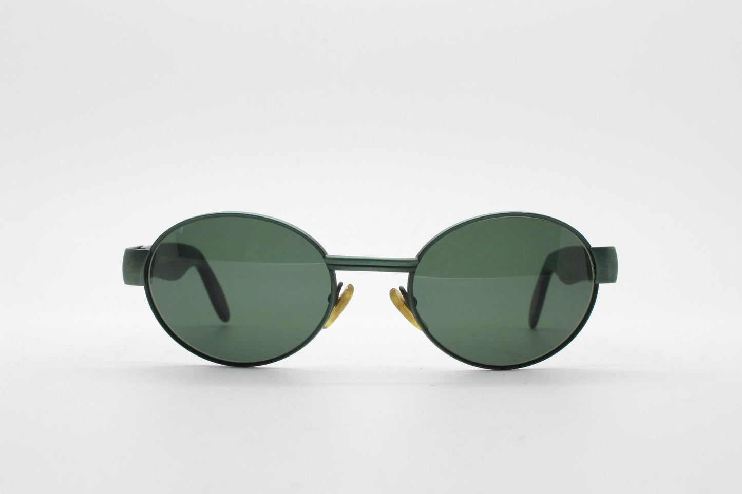 Safilo for Oxydo 90s vintage oval sunglasses made in Italy. Green matt finish solid metal frame with black arms and green lenses. Unused NOS