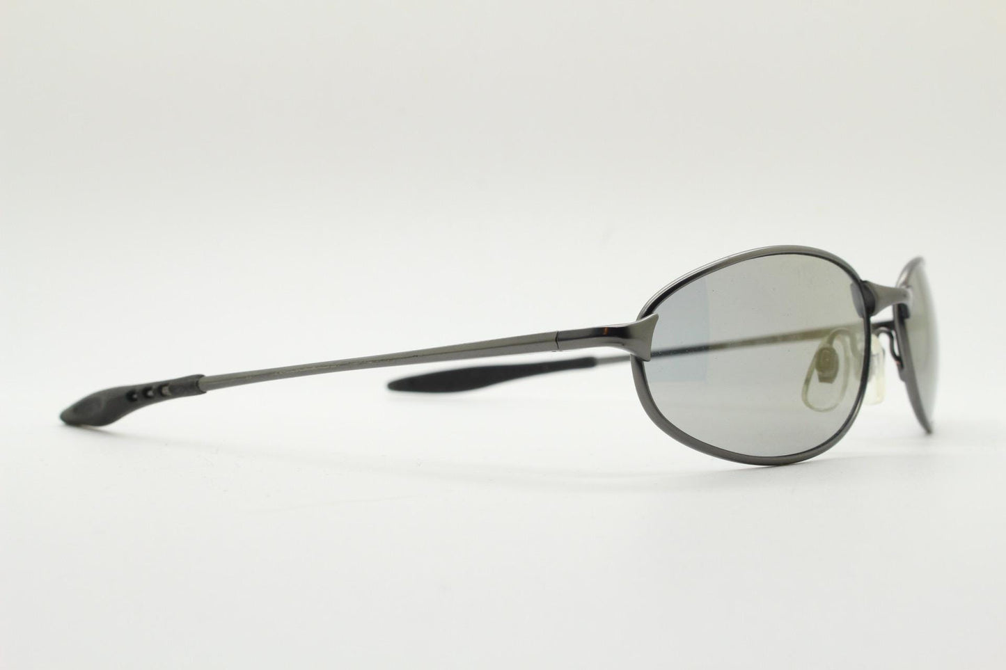 90s vintage oval small  bug eye sunglasses. Satin finish frame in gunmetal with straight spear arms. Y2K. 2000s. Unworn NOS