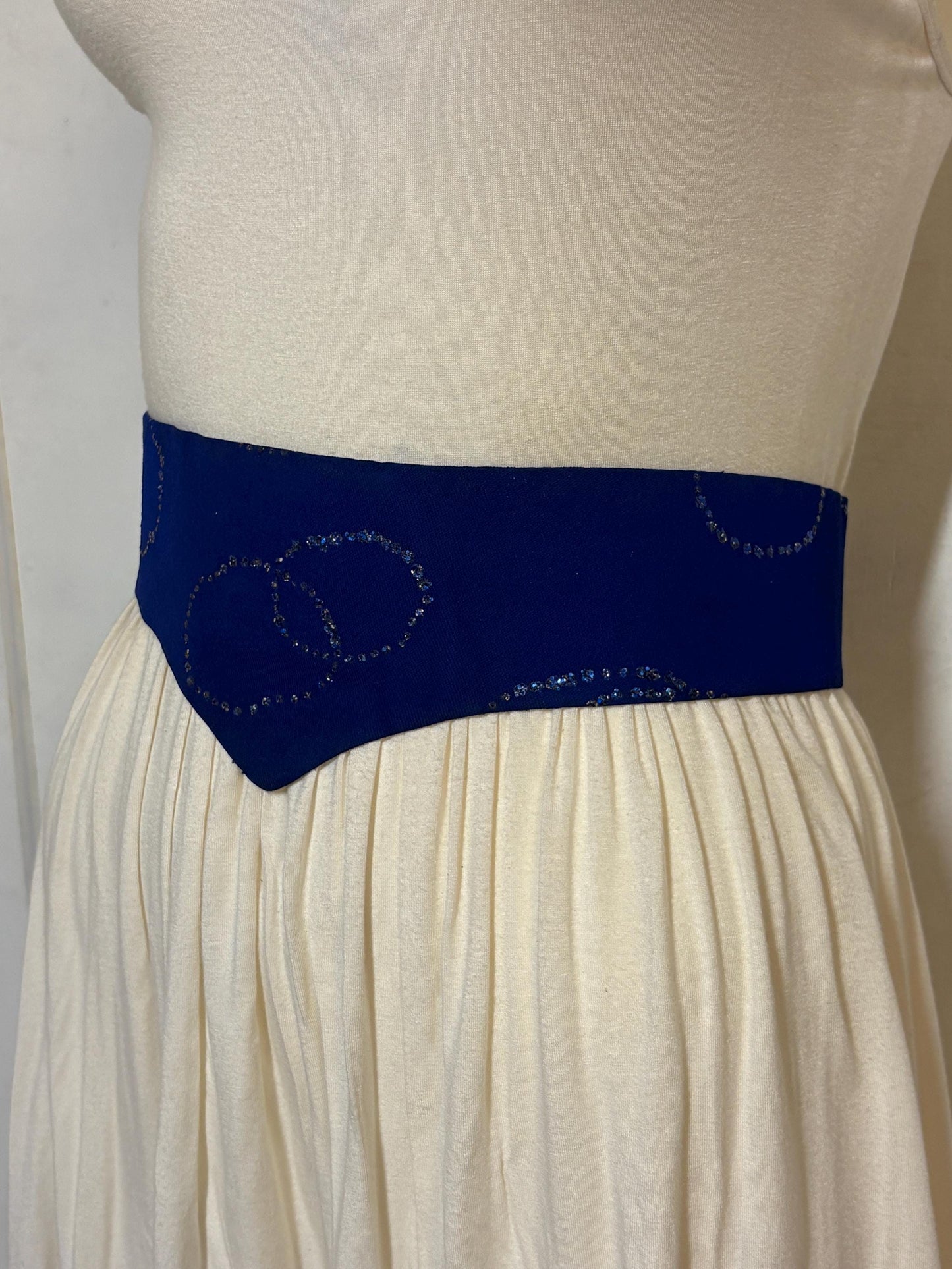 80s vintage womens hand made feature belt for a dress. Flattering V shape. Blue fabric with abstract glitter circles on a leather backing