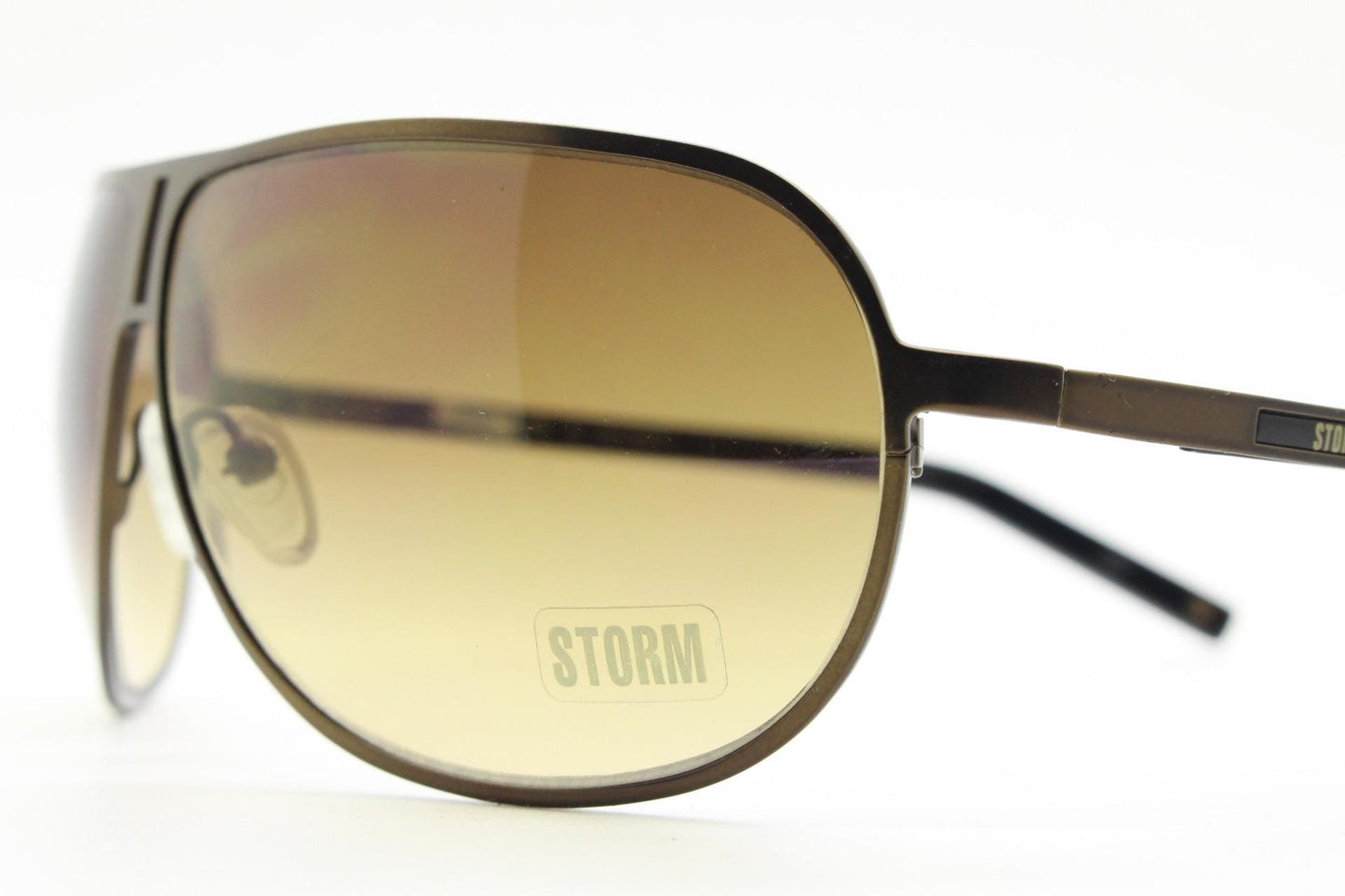 Storm Y2K bug eye aviator sunglasses model Photon. Bronze satin finish shield style aviators with graduating brown lenses.  Unused NOS.