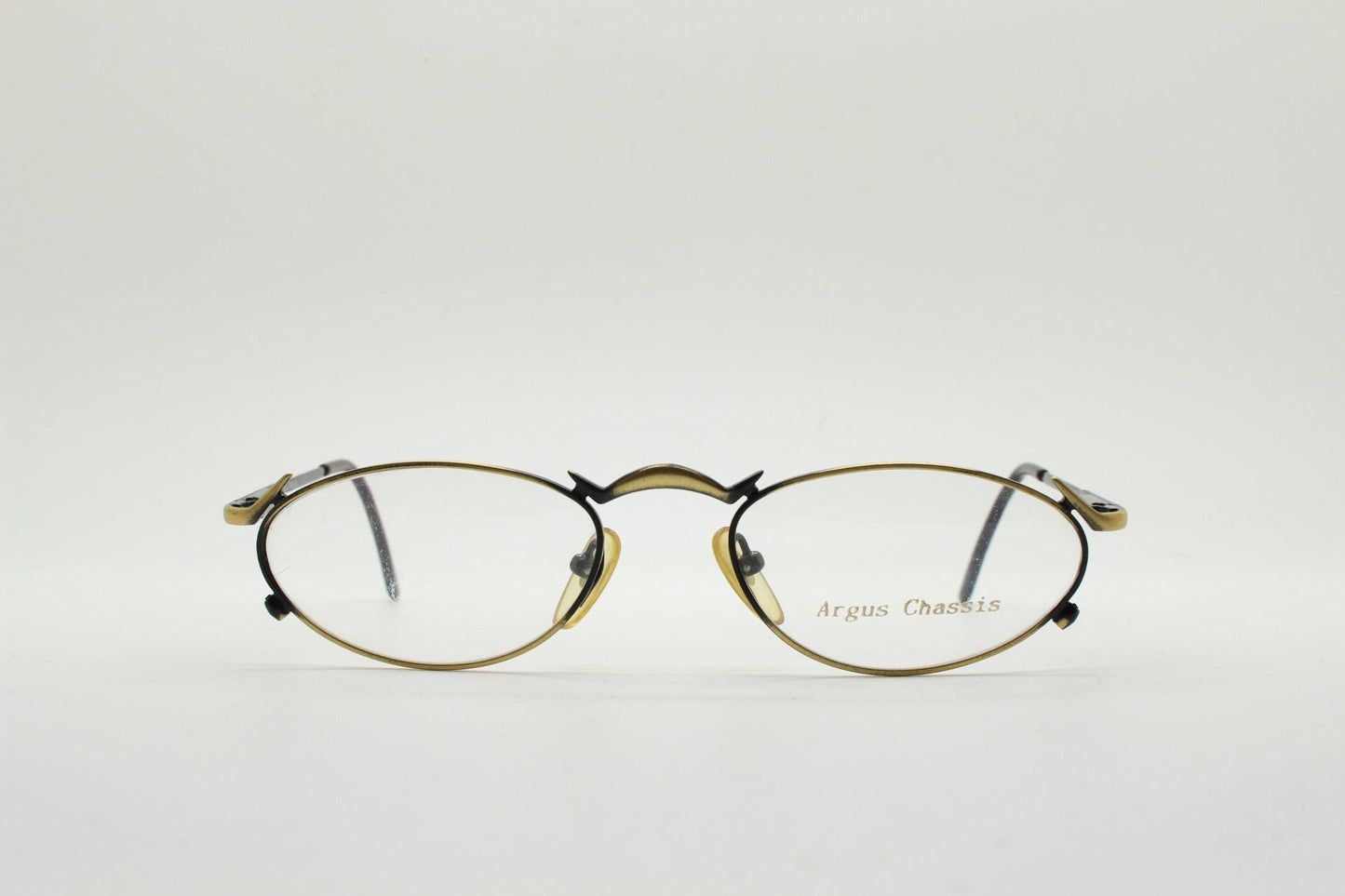 90s vintage oval eye glasses by Argus Chassis. Brushed bronze optical frames with dynamic spikes. Prescription cosplay fetish spectacles NOS