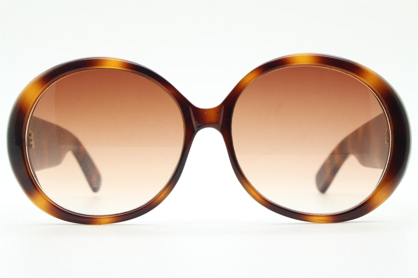 90s vintage round sunglasses. 60s style thick honey tortoise frame with graduating lenses and amber diamantes. Rhinestone. Unused NOS
