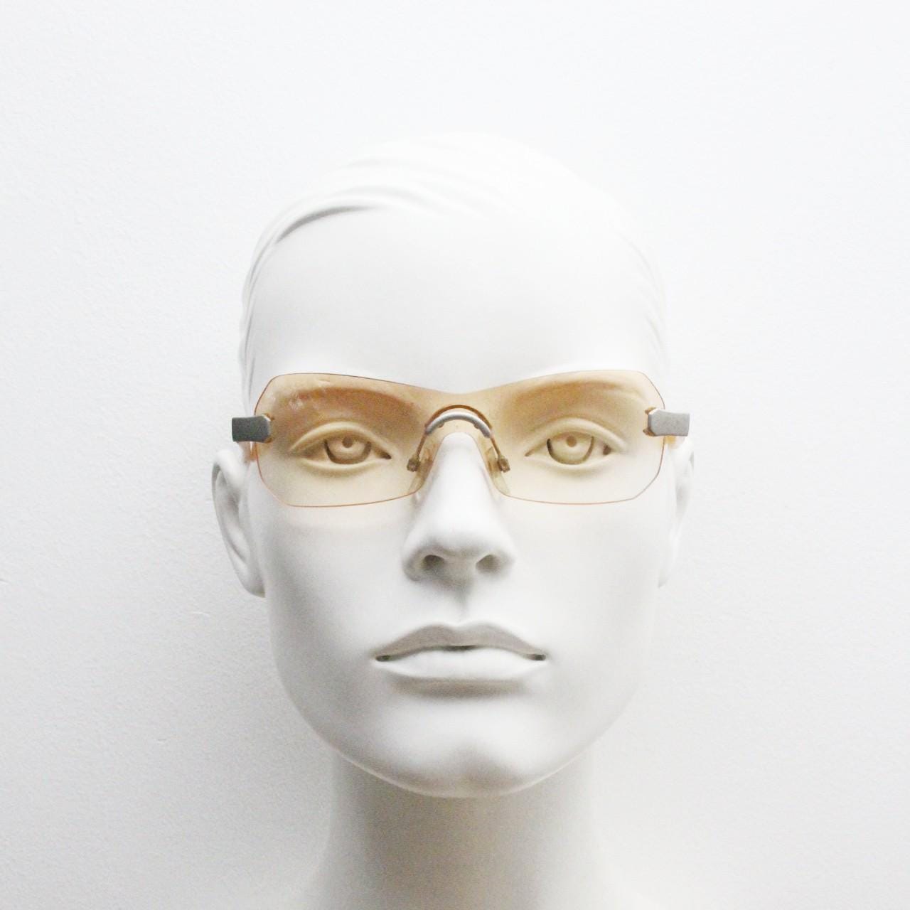 Y2K vintage frameless shield sunglasses. Dynamic 2000's light tone orange mono lens visor with matt silver trim. 00's Cosplay mini mask. NOS
