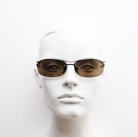 Y2K vintage oval aviator sunglasses. Metallic brown chrome half frame with mid tone curved bug eye lenses and straight arms. 2000's. NOS
