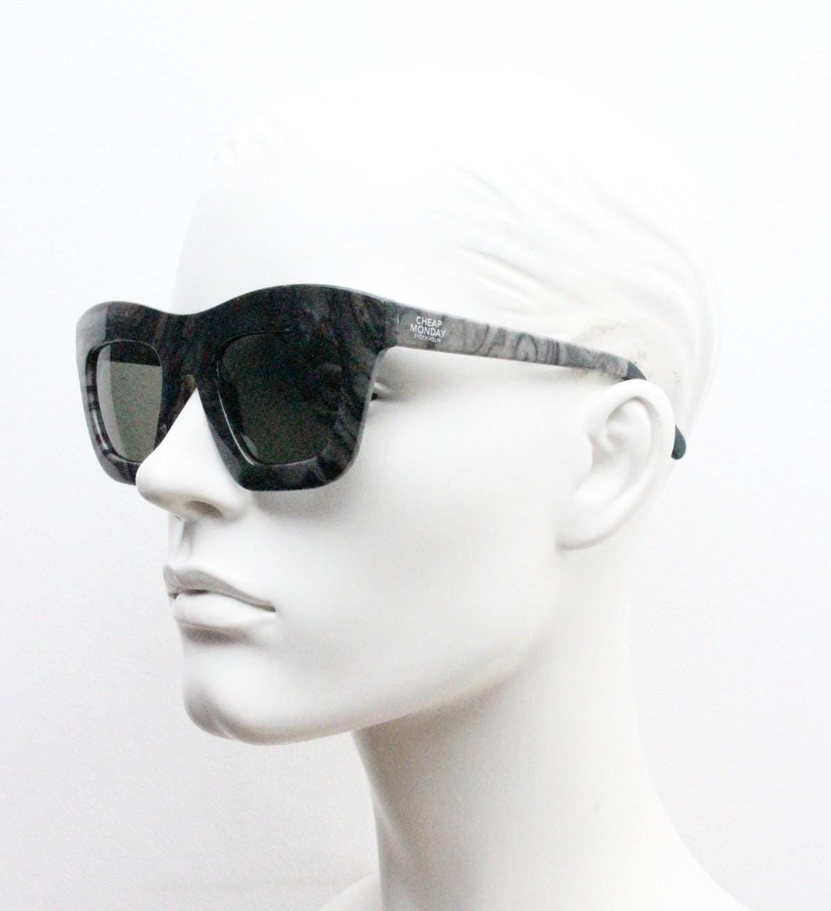 Cheap Monday thick frame cateye sunglasses. Womens chunky oversized grey and black marble cat eye with dark green lenses. Y2k vintage