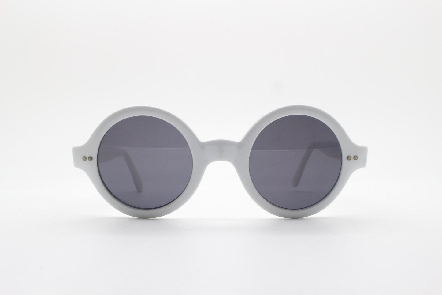 90s vintage round monochrome sunglasses. 30s design in an ice white frame with plain black lenses. Quality construction unused NOS