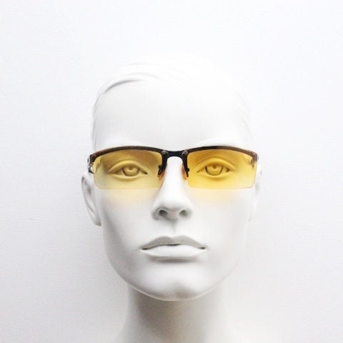 Y2K vintage half frame visor sunglasses. 2000's black brow line with light tone blazing orange rectangular curved lenses. 00's