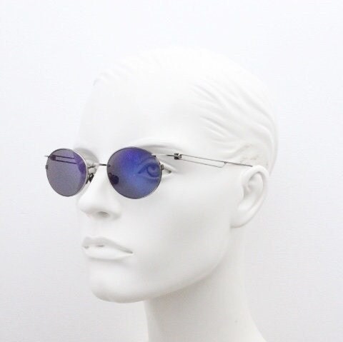 90s vintage oval sunglasses. Refined 'industrial tech' style brushed bronze metal frame with cool blue mirror lenses. Unused NOS
