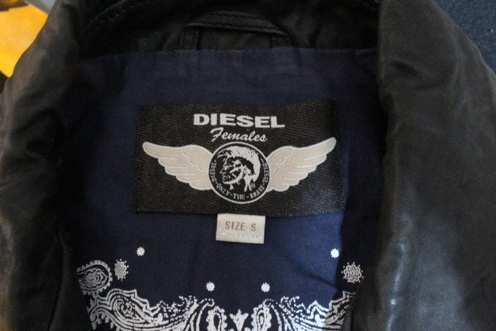 Diesel black fitted womens motorcycle jacket. Genuine leather cropped biker design with fixed adjustable belt. Over 30% sale rrp 469 GBP