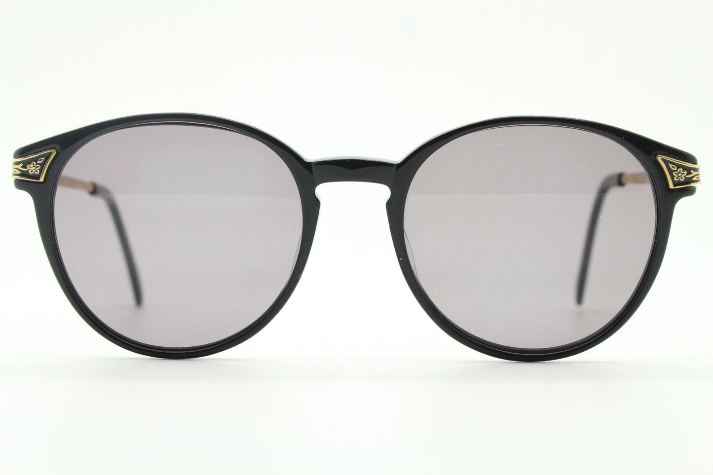 Laura Ashley 90s vintage round sunglasses. Refined 1940s design in black acetate with ornate embossed metal arm details. Unused NOS