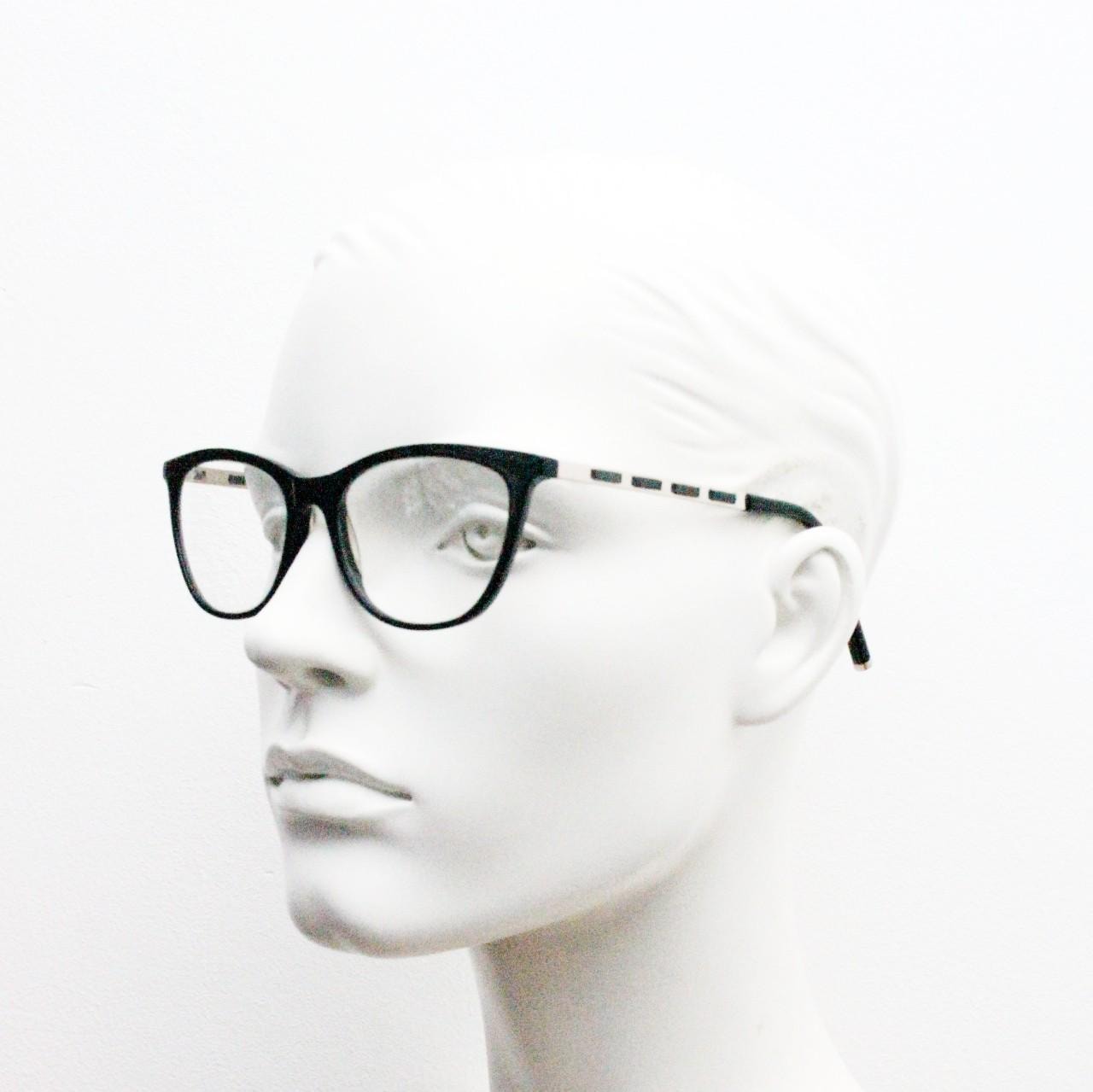 Vintage elegant cat eye glasses by Heritage. Black gloss acetate optical frames with leather lattice arms. Prescription RX cateye spectacles