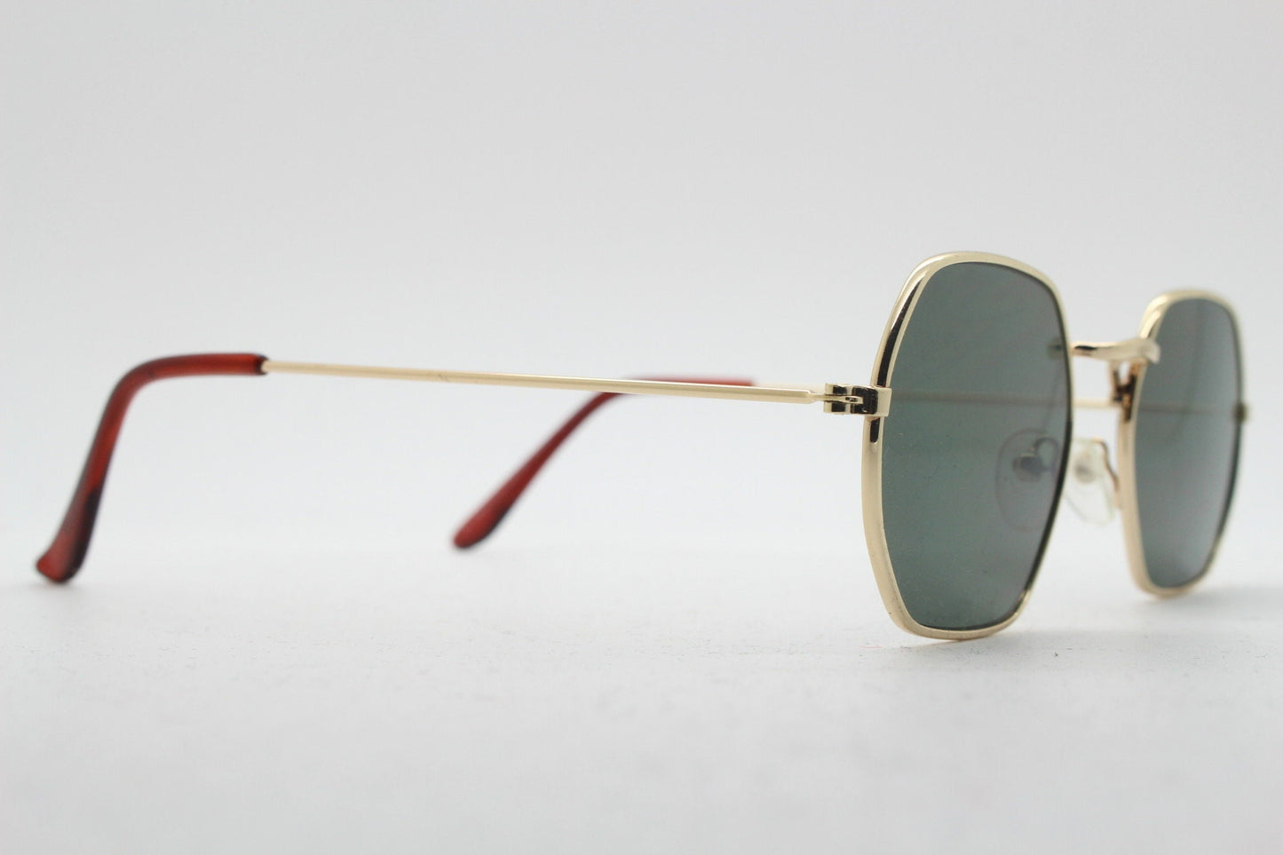 90s vintage hexagon sunglasses. Low profile slim gold 60s design frame with flat green lenses Octagon