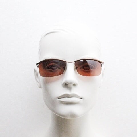 Y2K vintage curved rectangular sunglasses. Minimal half frame brow line design in brown satin finish with mid tone lenses. 2000's. 00's NOS