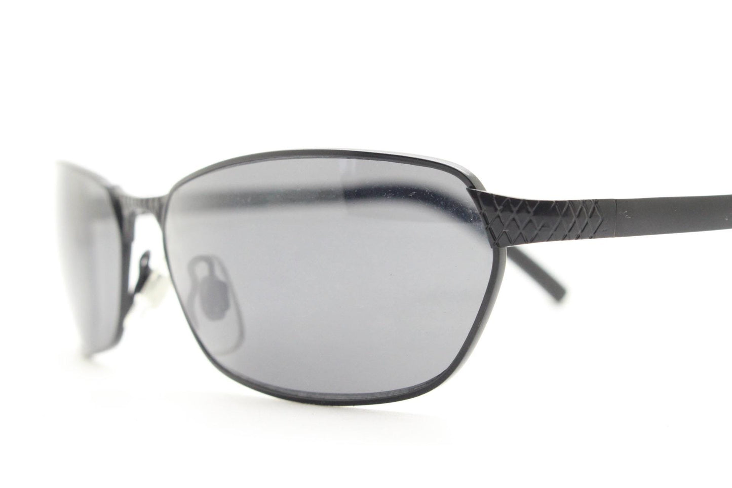 90s vintage wraparound sunglasses. Black satin finish on rectangular frame with unassuming style details. 2000's. Y2K. Unused NOS bug eye
