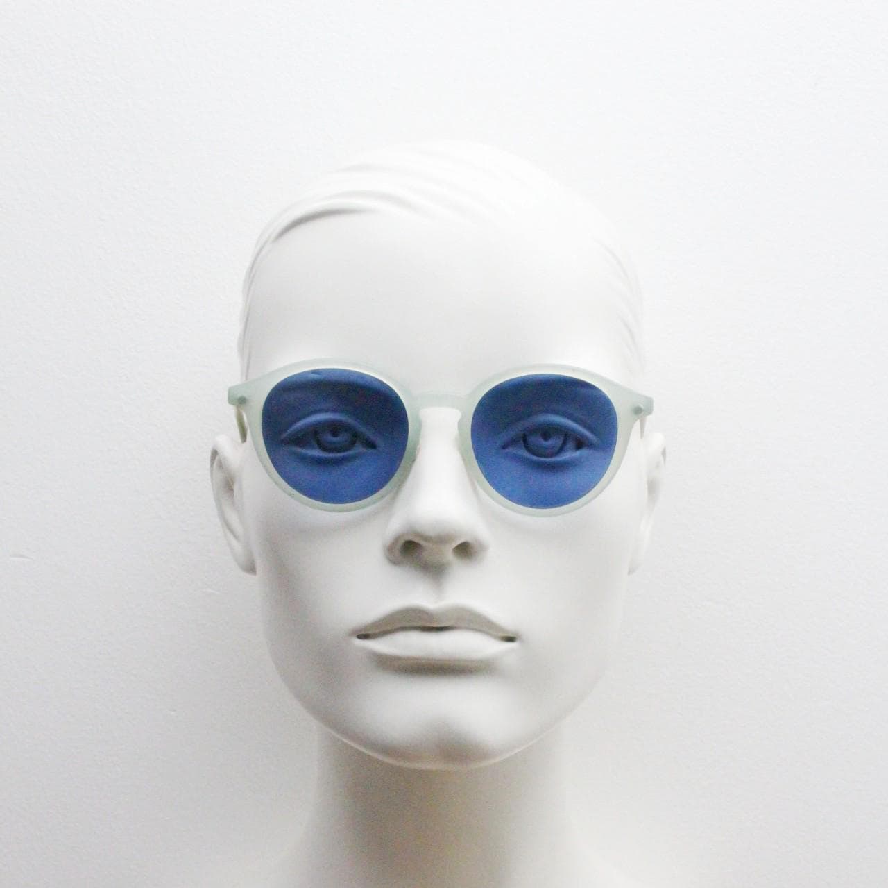 Sergio Tacchini 80s vintage round horn rim sunglasses made in Italy. Transparent pale blue frosted acetate frame with navy lenses. NOS