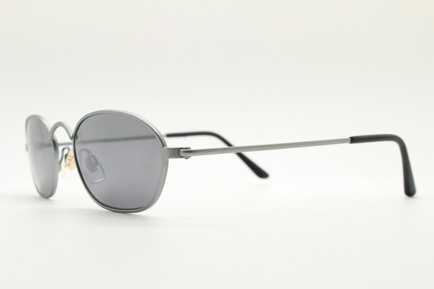 90s vintage small angular oval bug eye sunglasses. Minimal brushed satin finish frame with silver mirror lenses. Y2K. 2000s. Unworn NOS