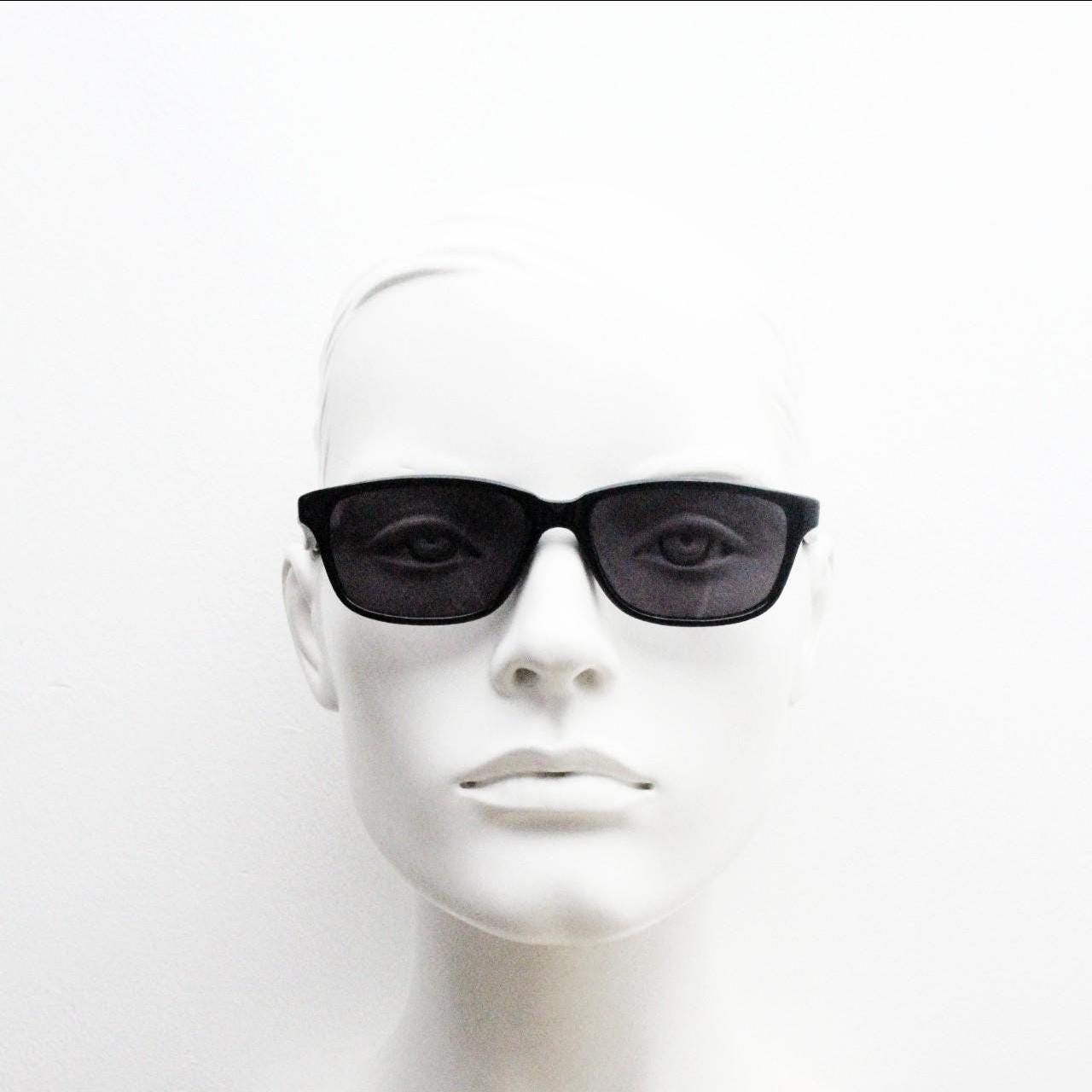 Vintage 90s slim rectangular modified wayfarer design sunglasses made in Italy. All black gloss low profile acetate frame. Unused NOS