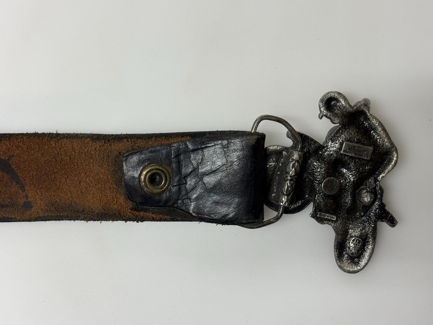 70s vintage Bergamot brass works 3D motorbike rider buckle on black genuine leather textured and embossed changeable belt. Moto X scrambler