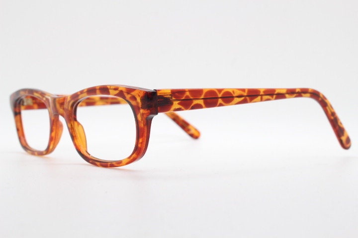 90s vintage rectangular low profile eye glasses. Transparent optical frame with vibrant amber giraffe pattern. Prescription eyeglasses. RX