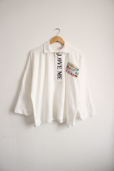 80s Vintage oversized polo shirt with 'LOVE ME' graphic print. Crop sleeve jumper. Unisex sweatshirt. Fashion grail sweater. NOS pullover