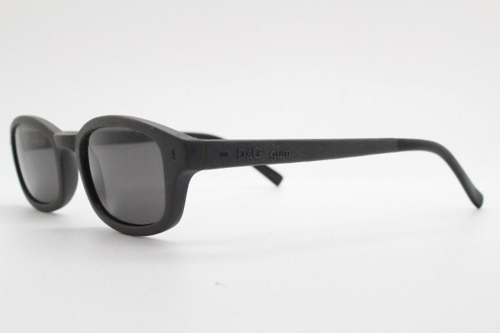 Dolce and Gabbana gum sunglasses made in Italy. Mens 90s vintage innovative flexible grey rubber frame with black lenses