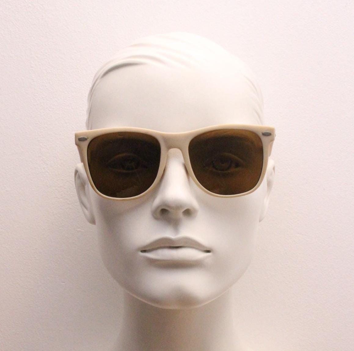 Vintage 80s wayfarer style sunglasses. All time classic slightly oversized design in matt white with brown lenses. Flava Flav