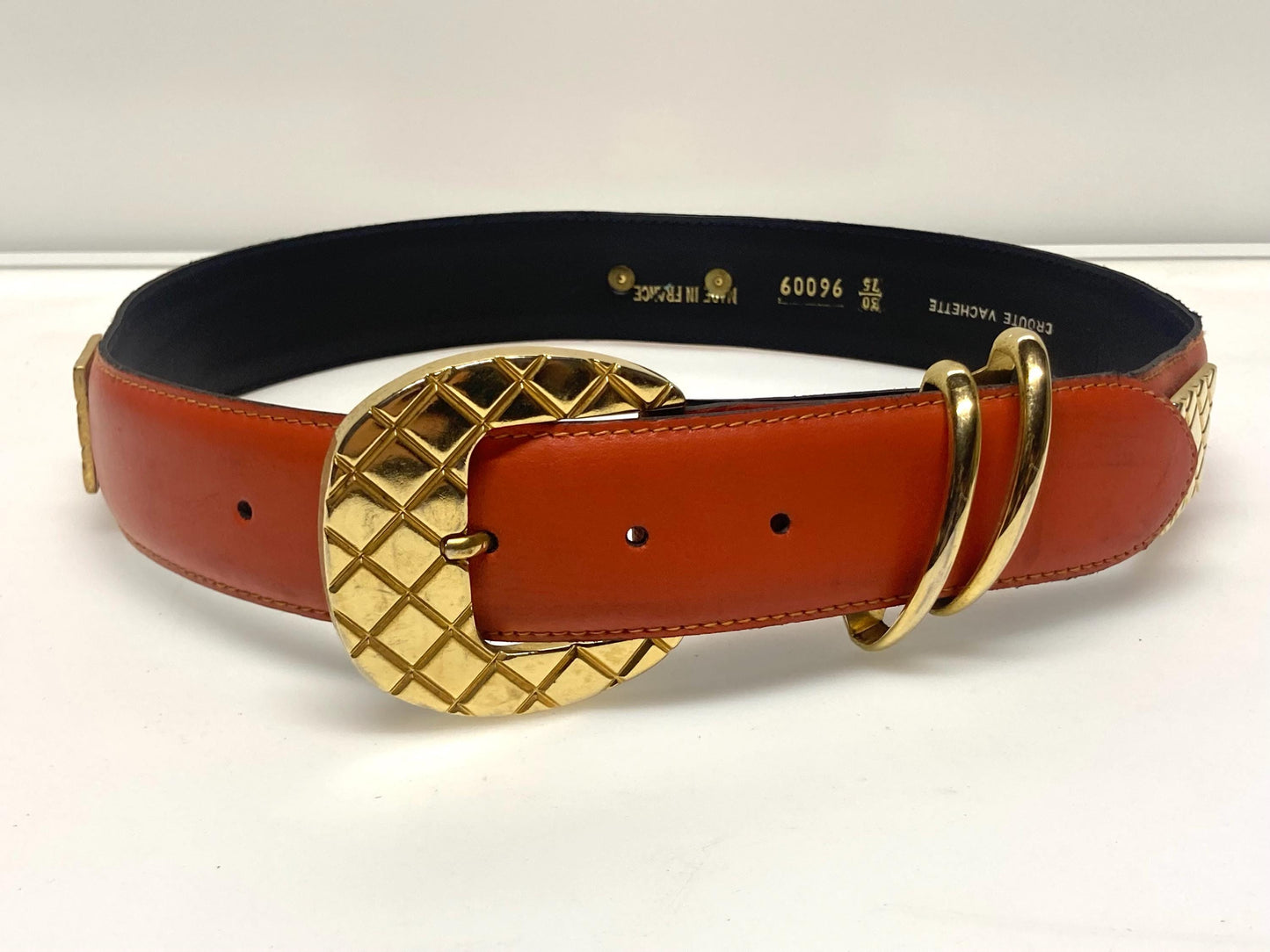 80s vintage womens dress / jeans belt in bright orange leather with golden metal squares. Made in France. Used in good condition