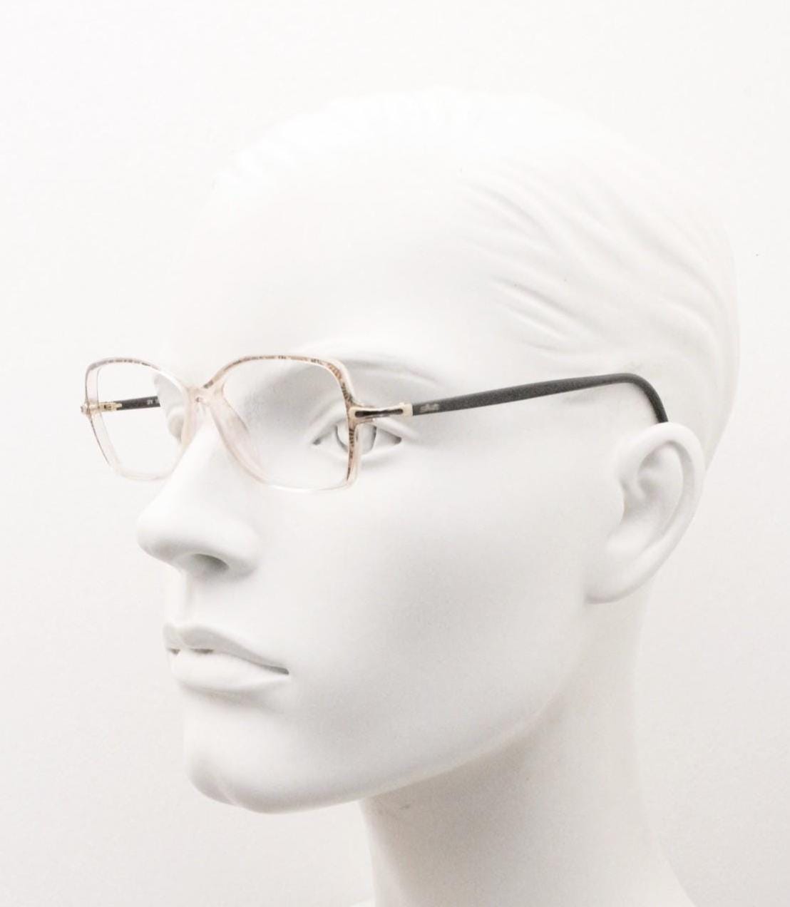 Silhouette 80s vintage oval eye glasses made in Austria. Transparent crystal optical frame with giraffe arm print. Prescription RX