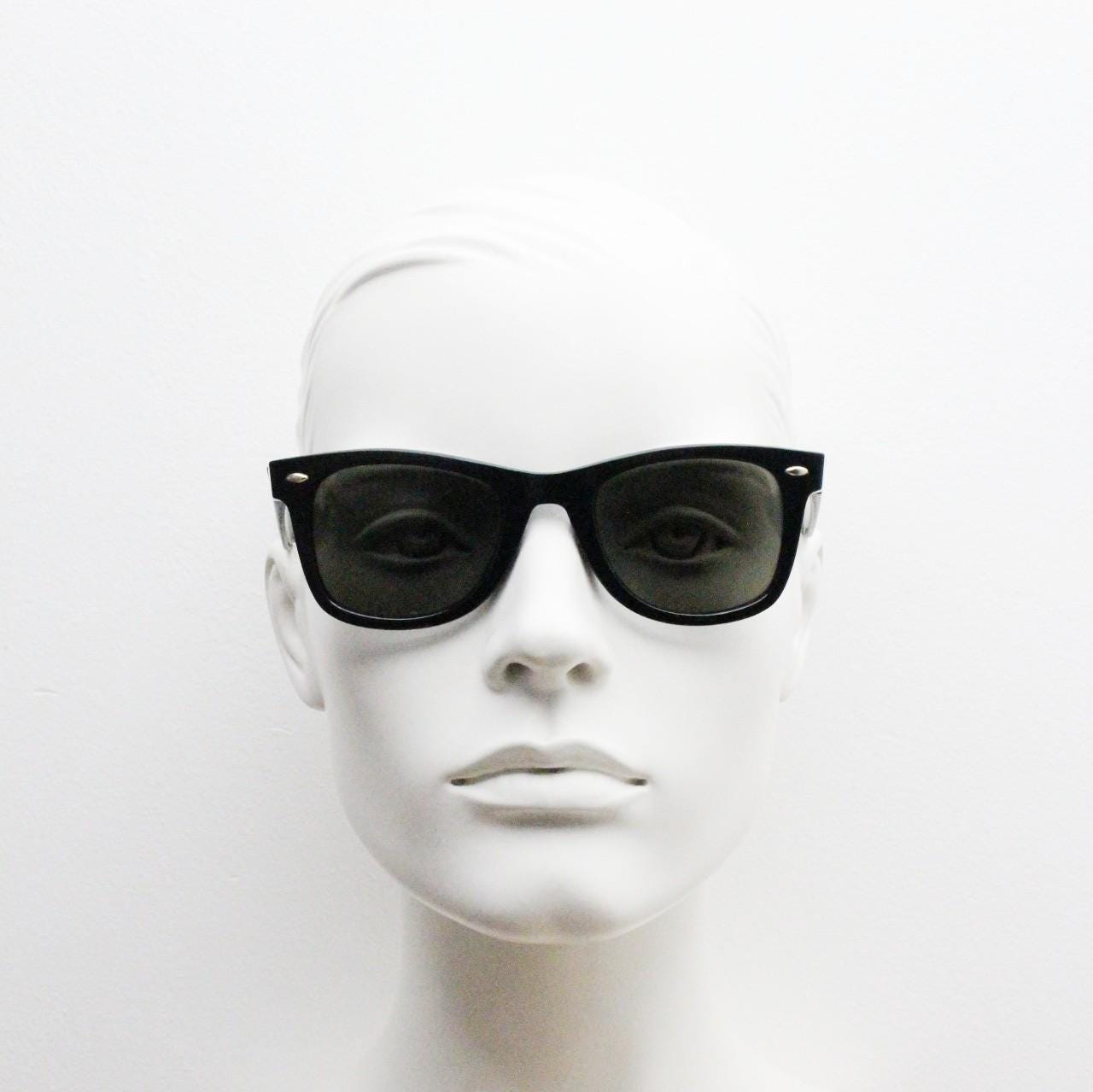 BCBG Max Azria vintage wayfarer design sunglasses. All time classic horn rim format in plain black gloss frame with green lenses.