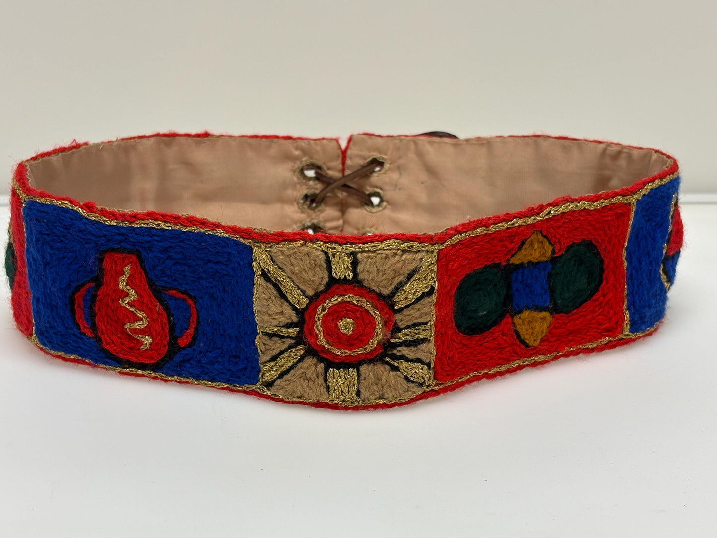 60s vintage completely hand made knitted belt. Embroidered sun, bird and abstract symbols with leather laced tie. Womens unique one off