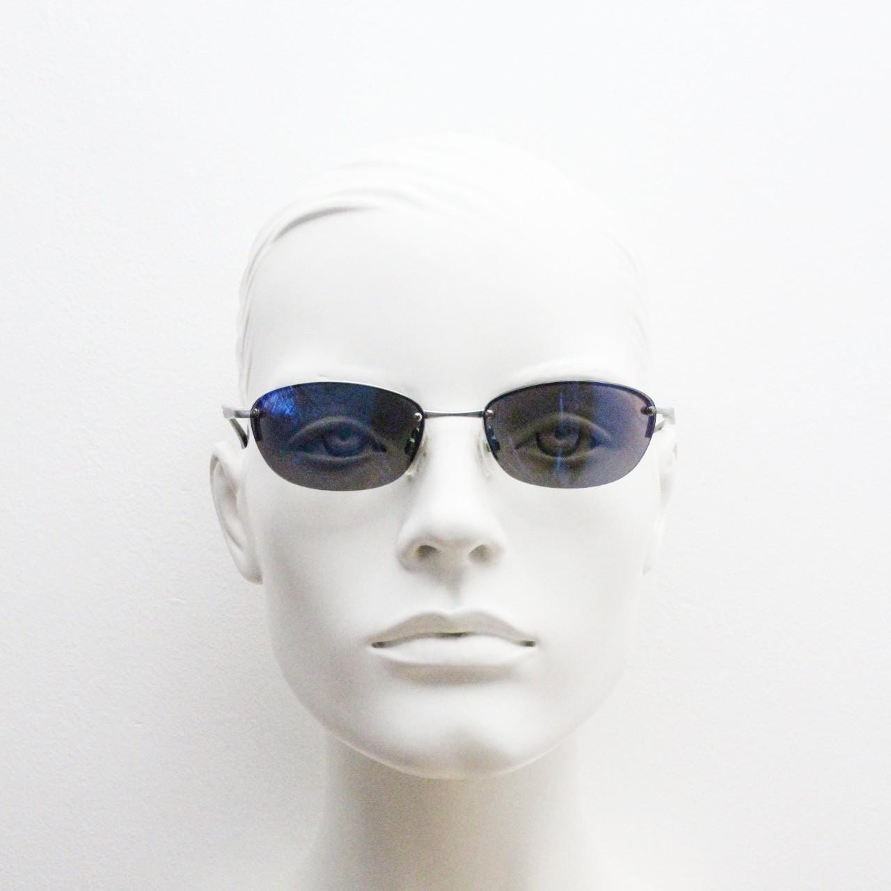 90s vintage small bug eye oval sunglasses. Minimal silver satin finish solid metal half frame with blue mirror lenses. Y2K.  NOS sample